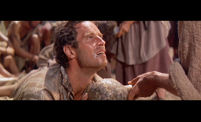 Judah Ben Hur receives his first contact with his supernatural help.  He receives water from the Christ, not knowing who he is at that moment.  Photo public domain.